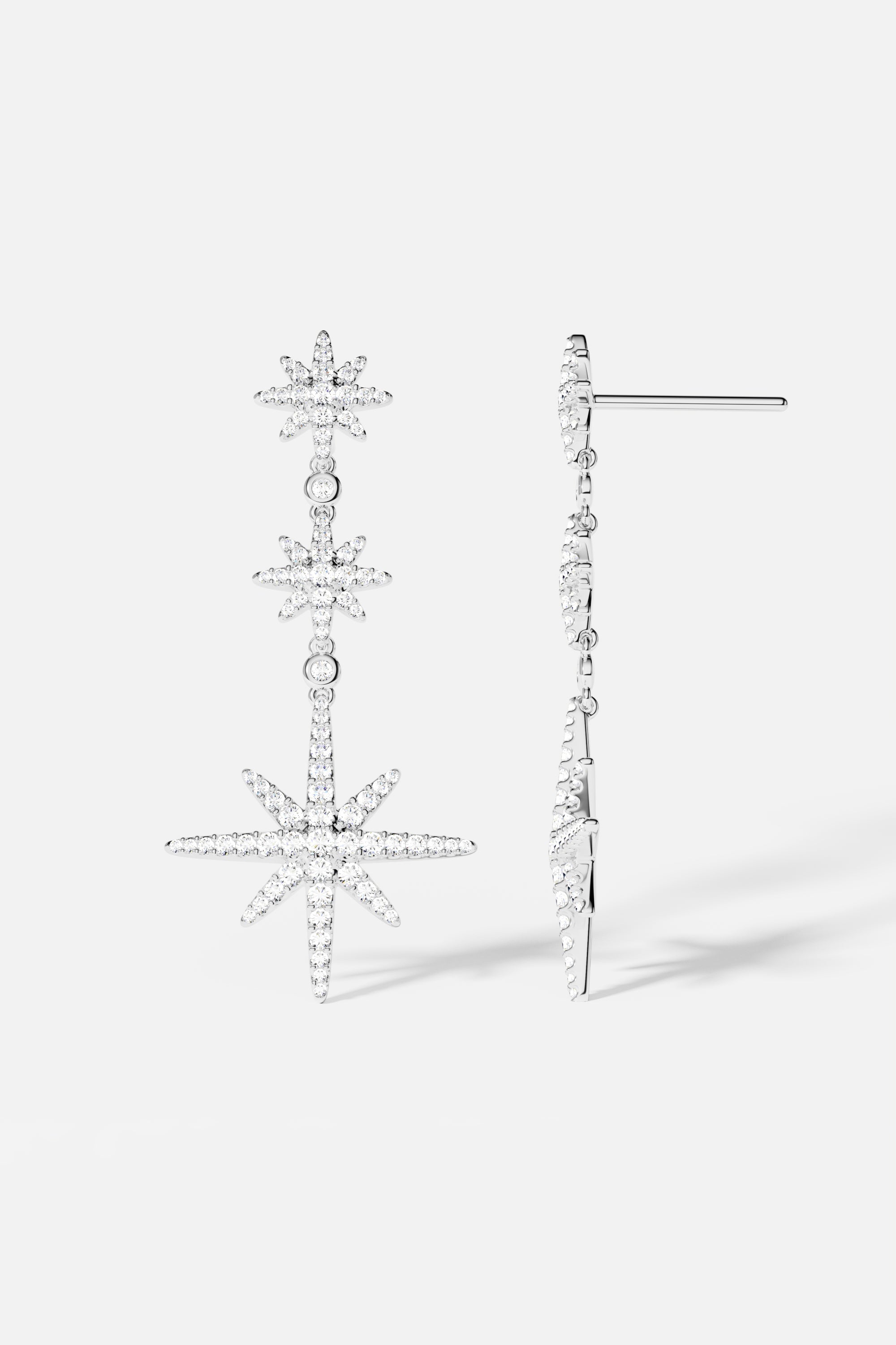 Earrings APM Monaco: silver-tone triple meteorites drop earrings with diamond accents.