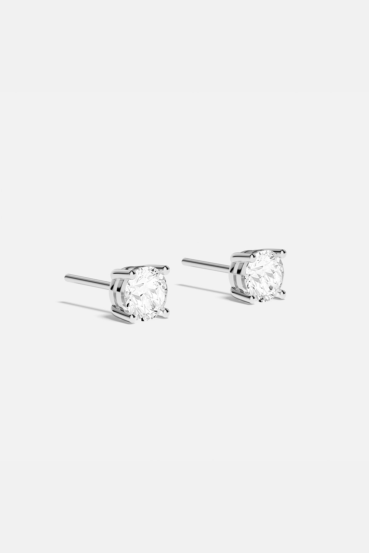 Earrings APM Monaco round stud earrings with white cubic zirconia.