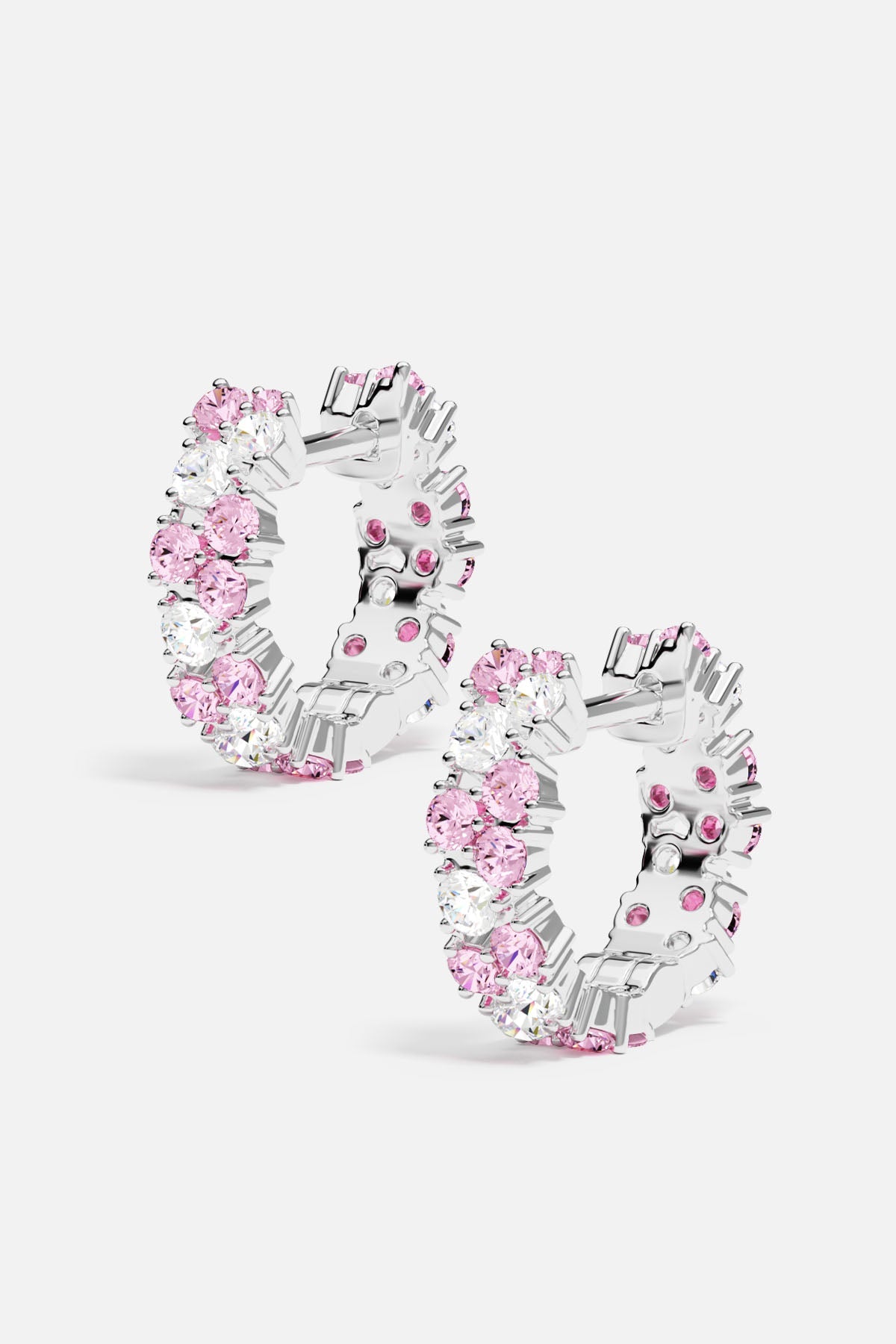 Earrings APM Monaco: white hoop earrings with rose-drop pink and clear crystals.