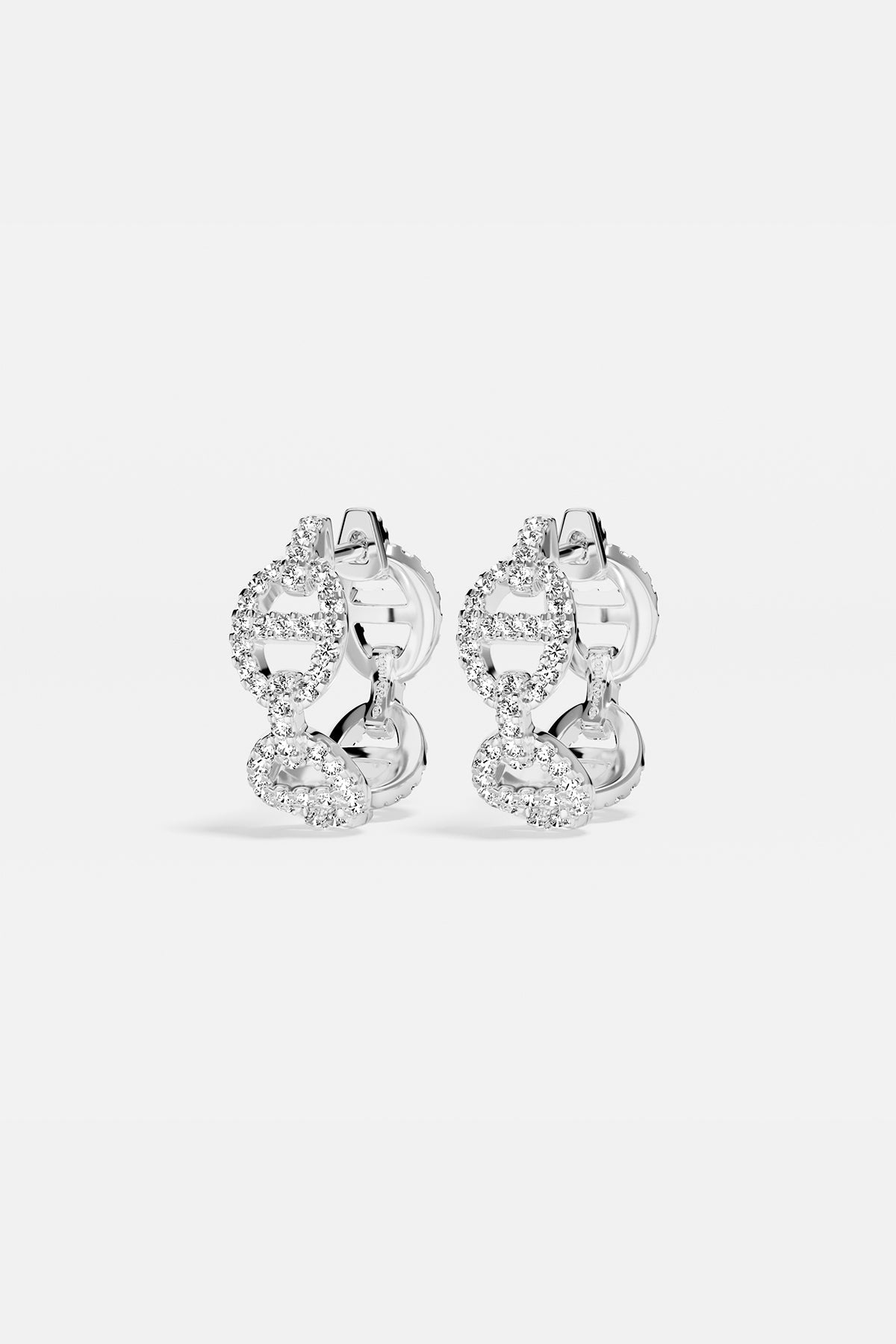 Earrings APM Monaco, silver-tone hoop earrings encrusted with white cubic zirconia.