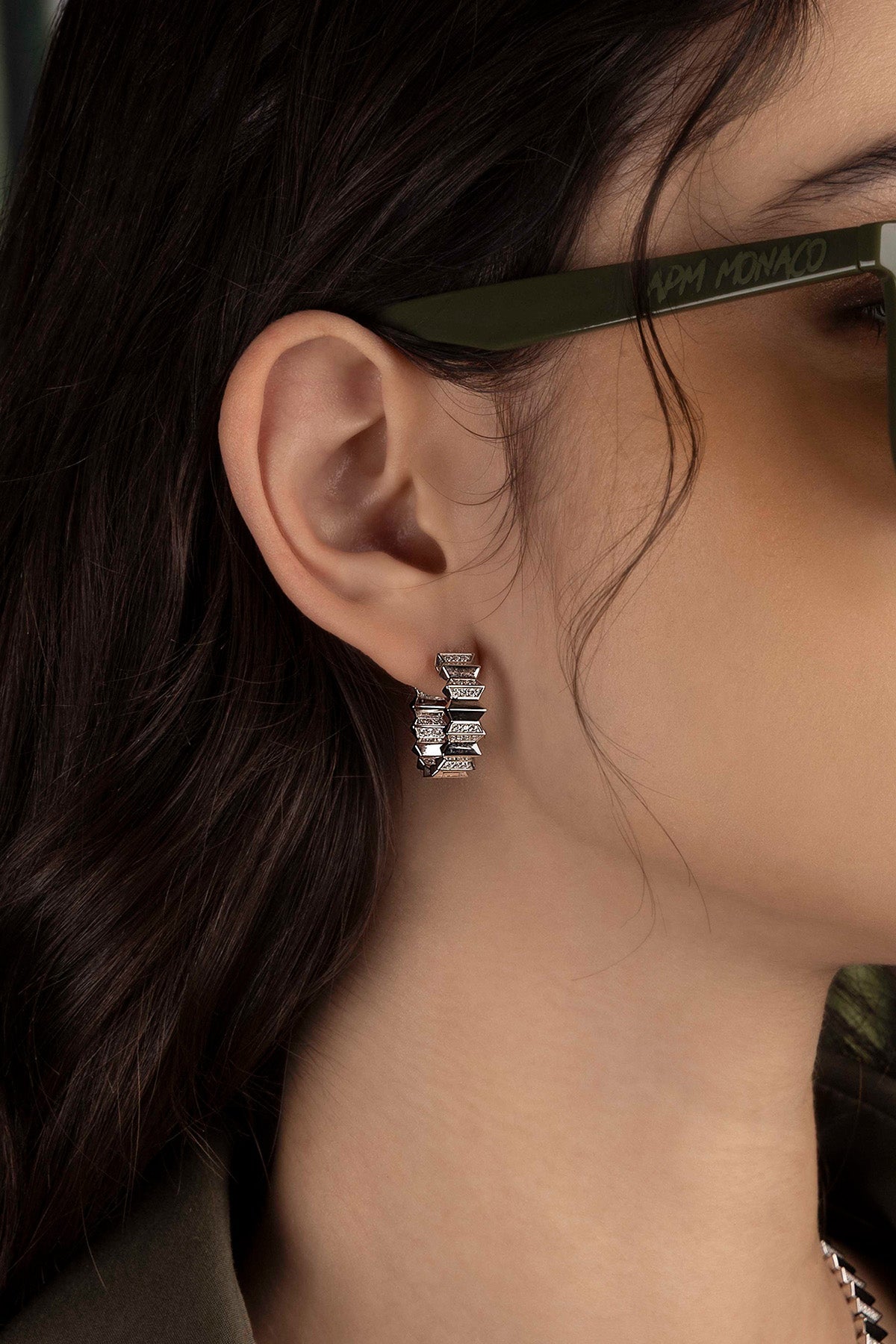 Close-up of an hoop earring with a blurred background