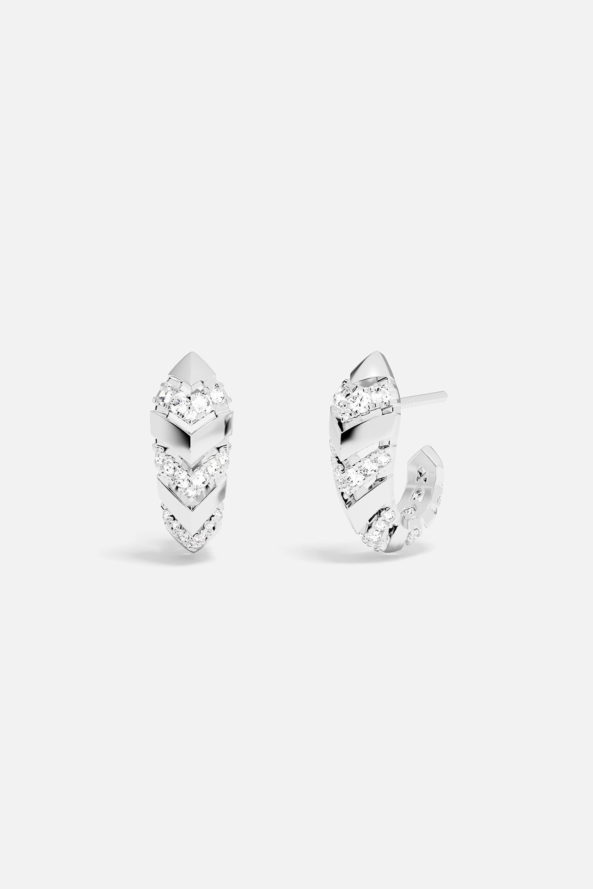 Pair of silver hoop earrings with white stones on a white background