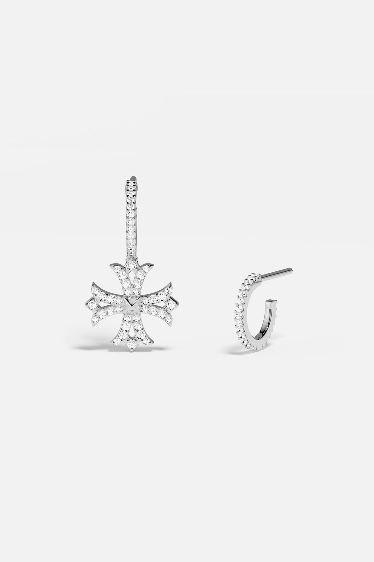 Silver earring with cross design on a white background