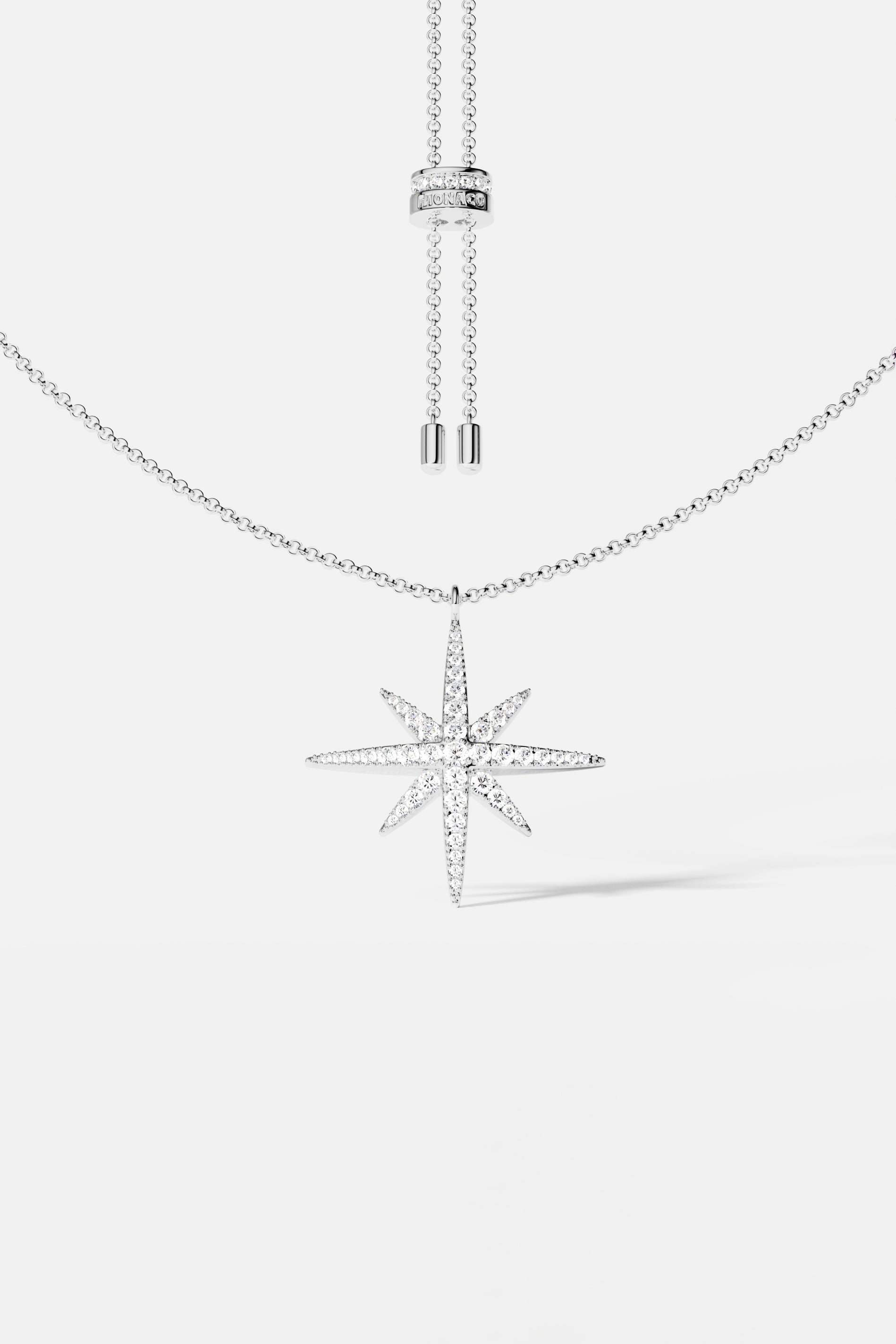 Necklaces APM Monaco white metal chain with a sparkly star-shaped pendant.
