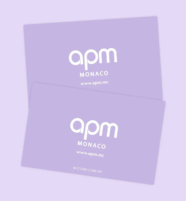 Two purple APM MONACO gift cards with 'apm Monaco' branding on a light purple background