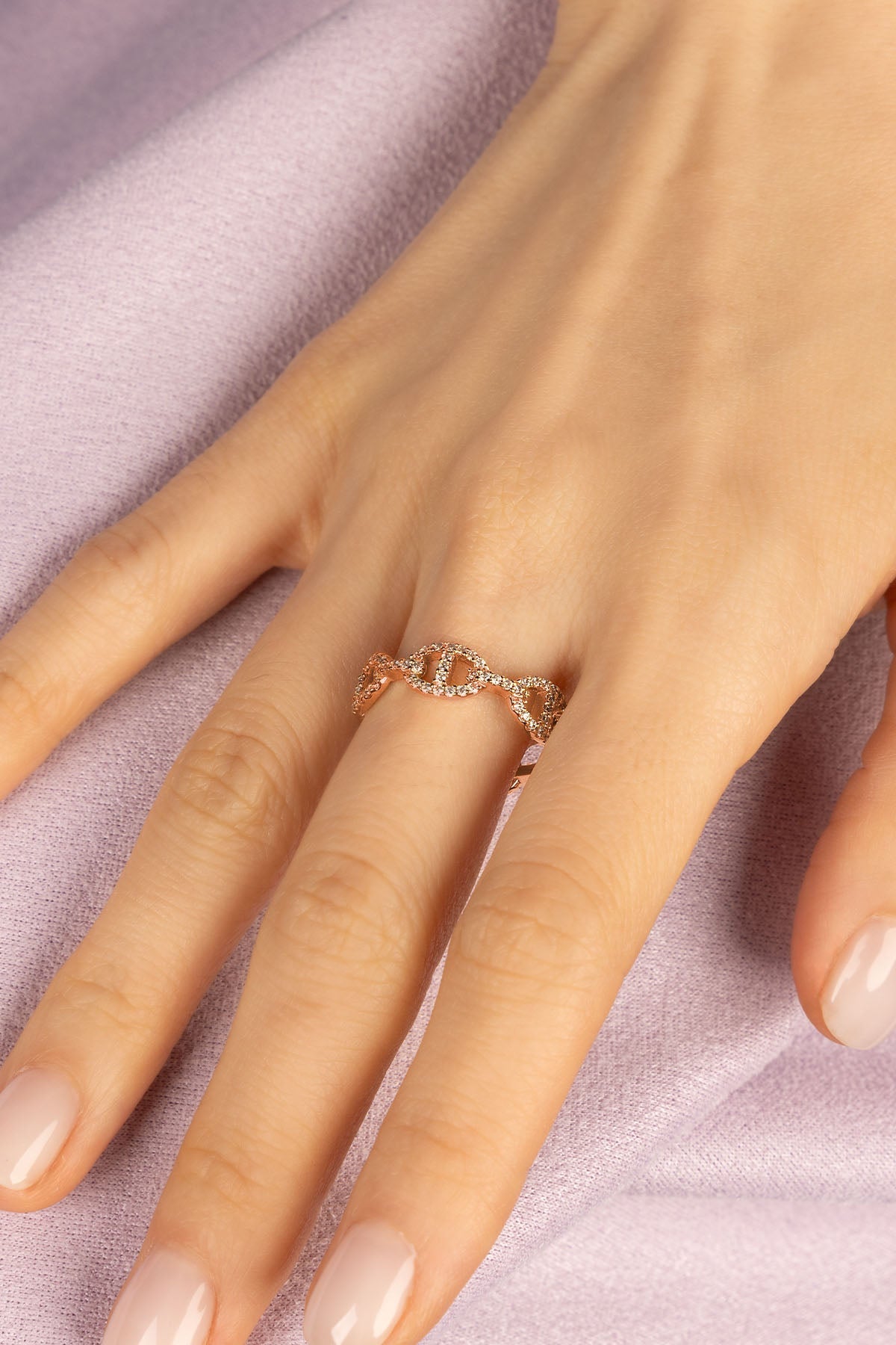 Rings APM Monaco rose gold maille marine ring with a distinctive linked chain design and pave white cubic zirconia.