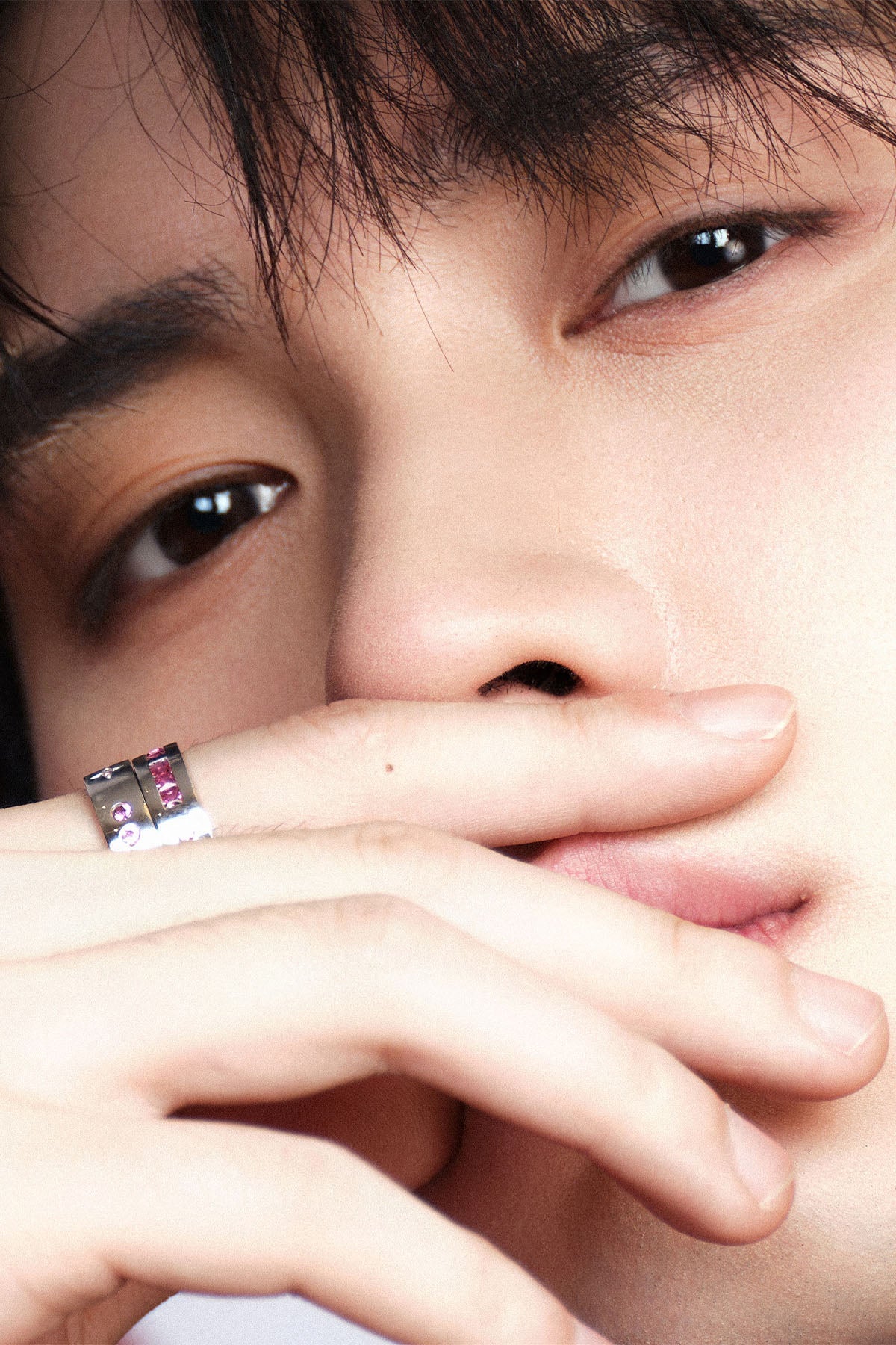 Close-up of a person with rings on their finger