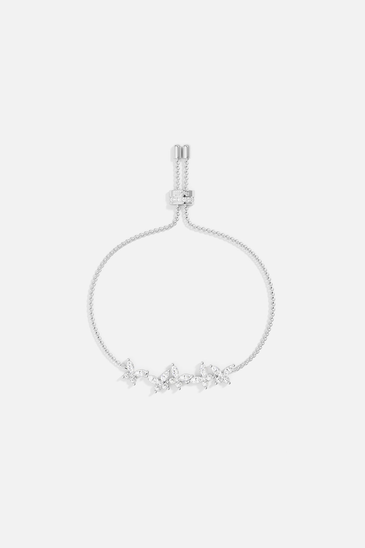 Silver necklace with butterfly design on a light gray background