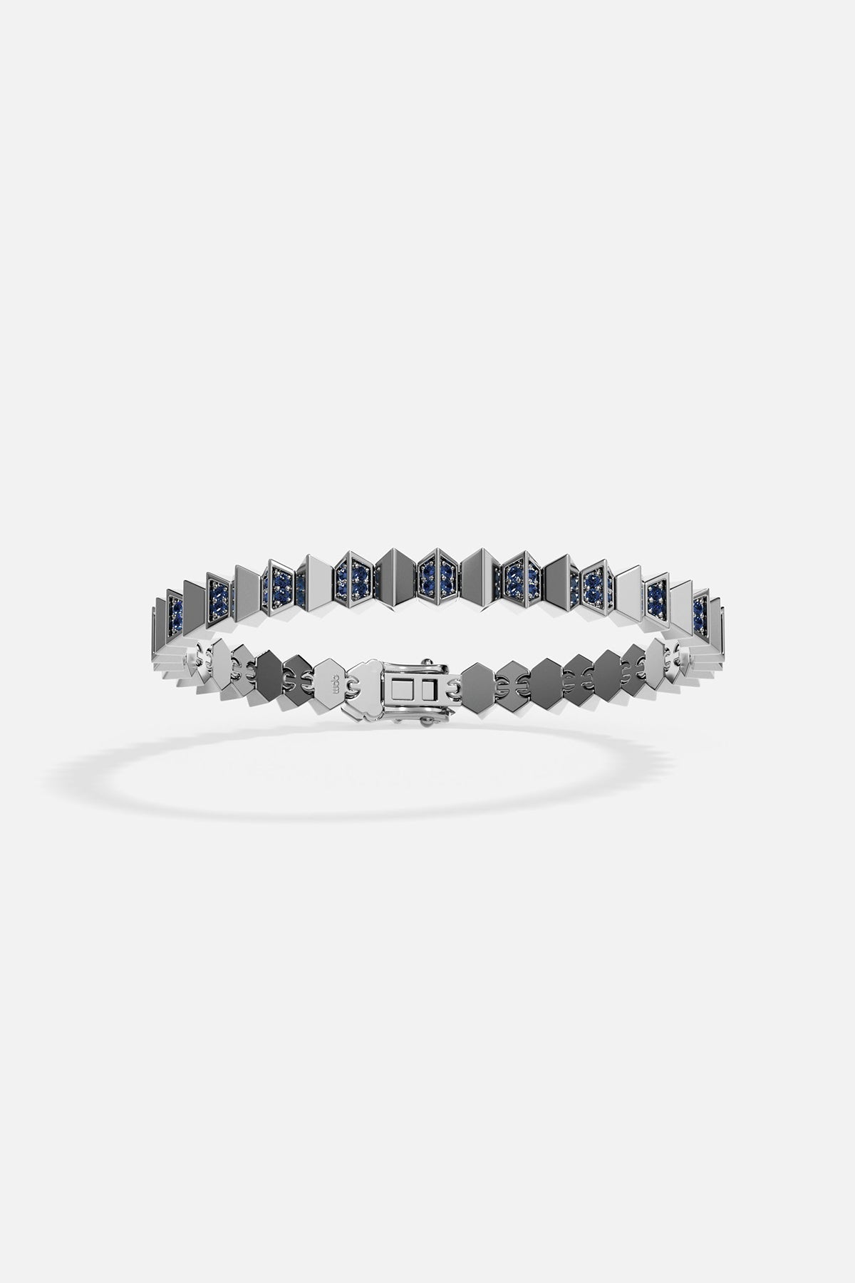 Silver bracelet with blue gemstones on a white background