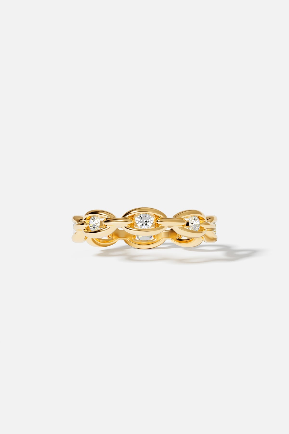 Rings APM Monaco yellow gold pave chain ring with three round white diamonds.