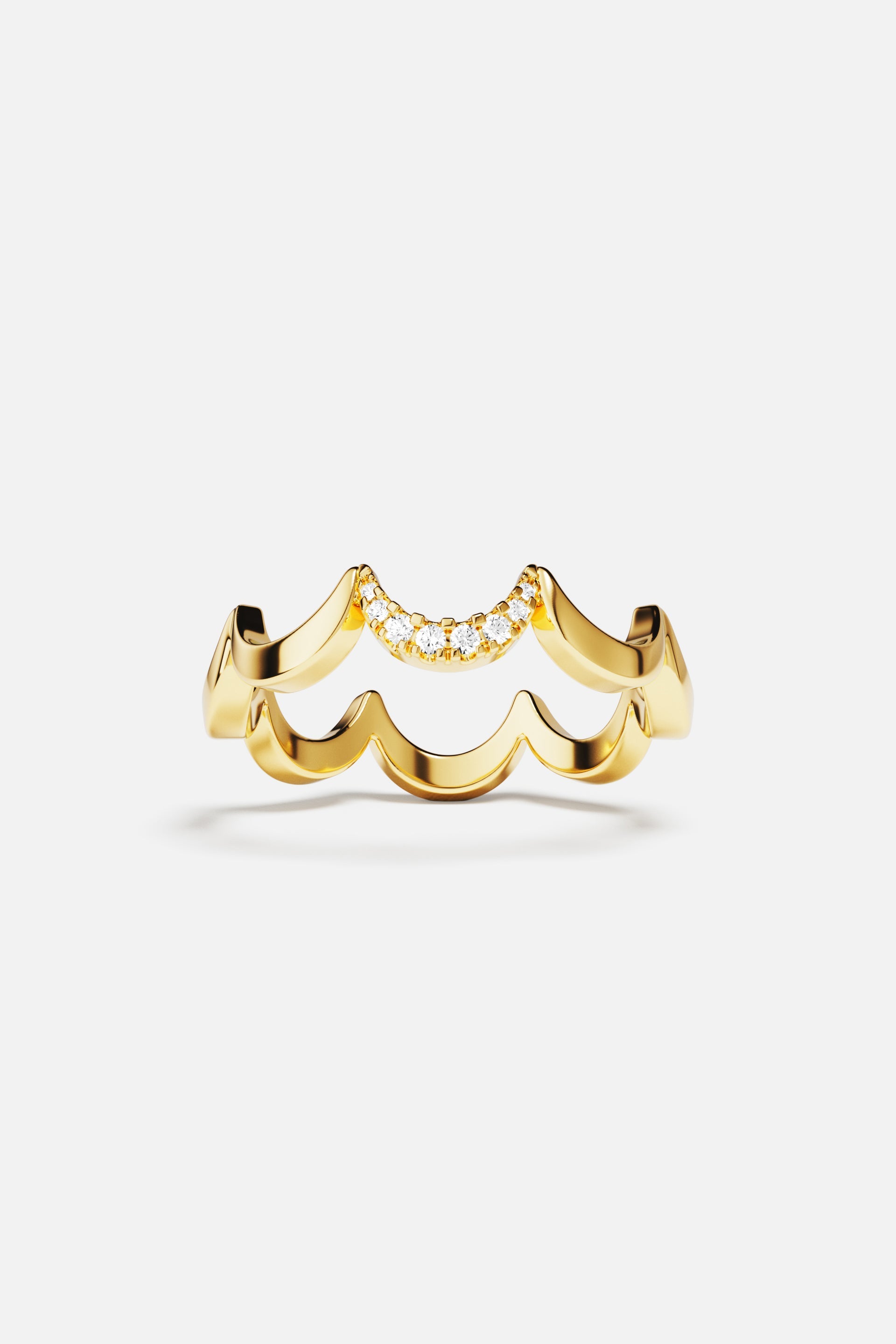 Rings APM Monaco, yellow gold wavy ring with pavé diamonds on top.