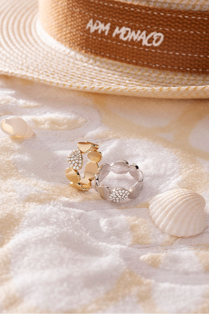 Rings APM Monaco with gold and silver tones and seashell detailing.