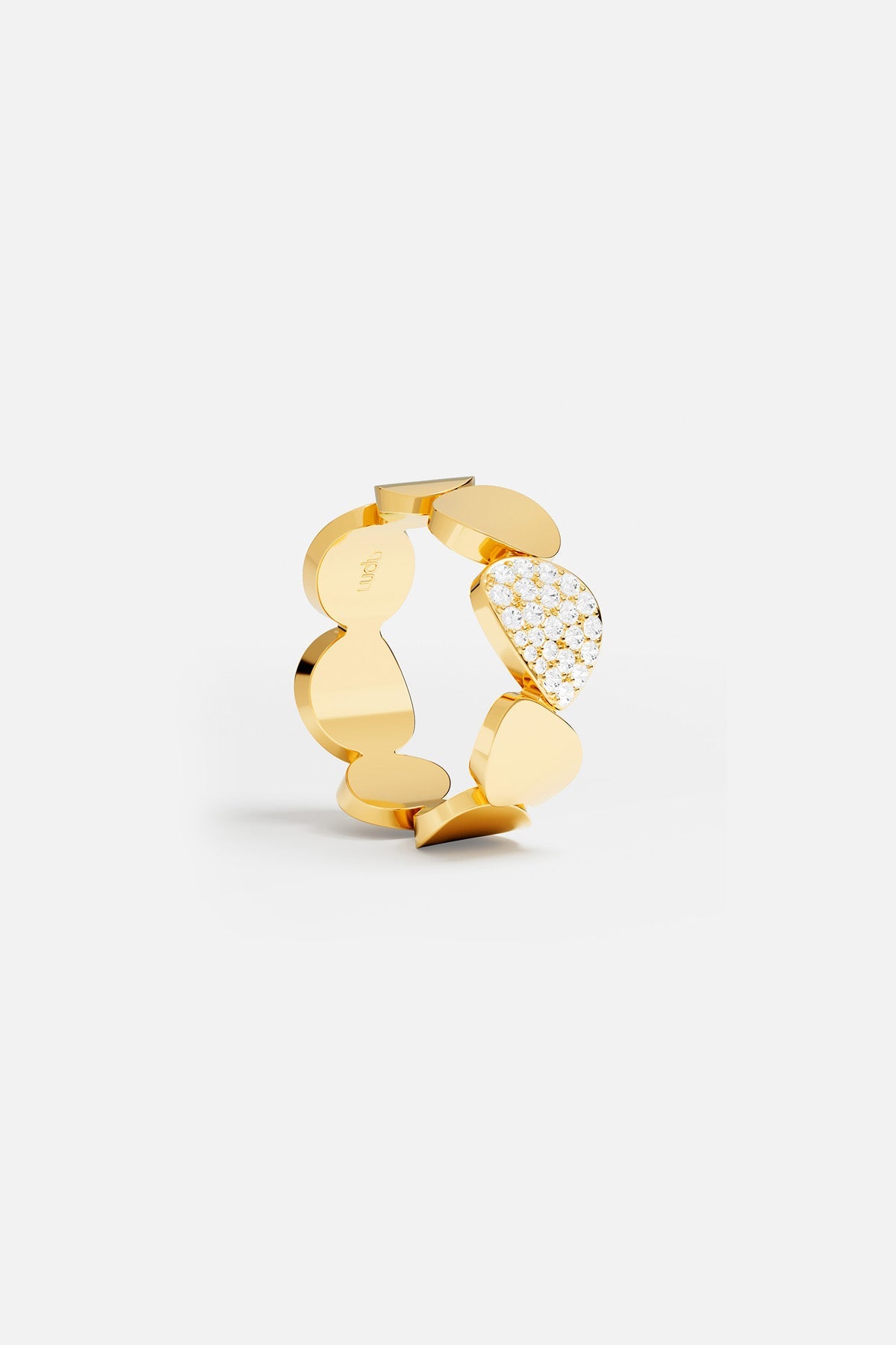 Rings APM Monaco: yellow gold ring with round and irregular segments, one segment pavé-set with white stones.