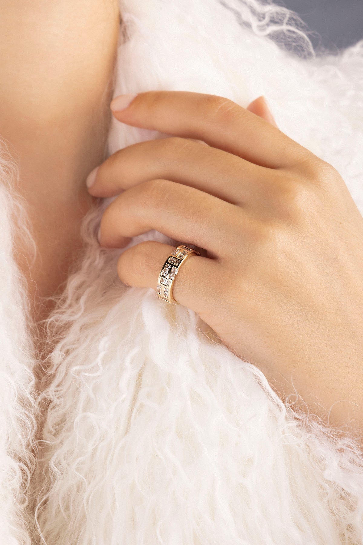 APM MONACO labyrinth ring in yellow gold worn by model hand