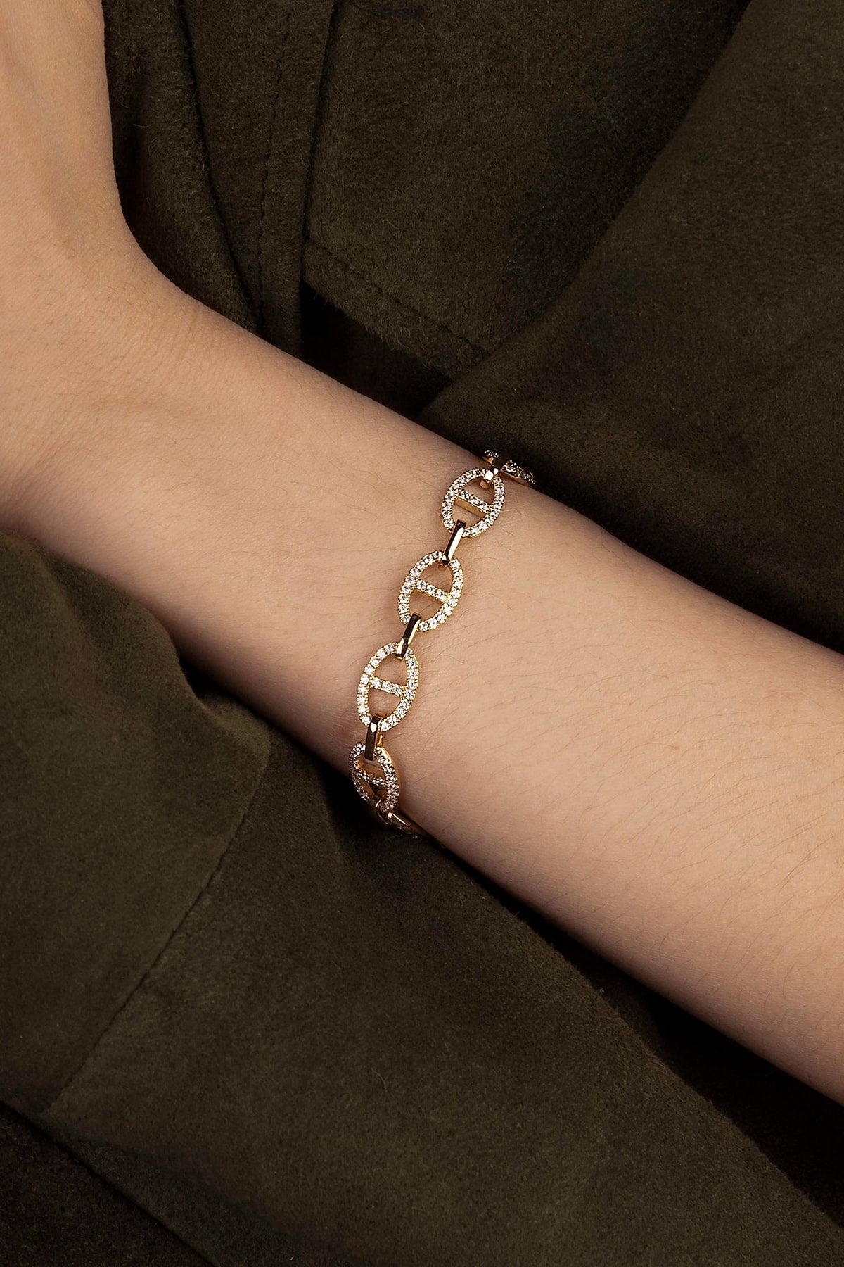 Bracelet on a wrist with a dark background