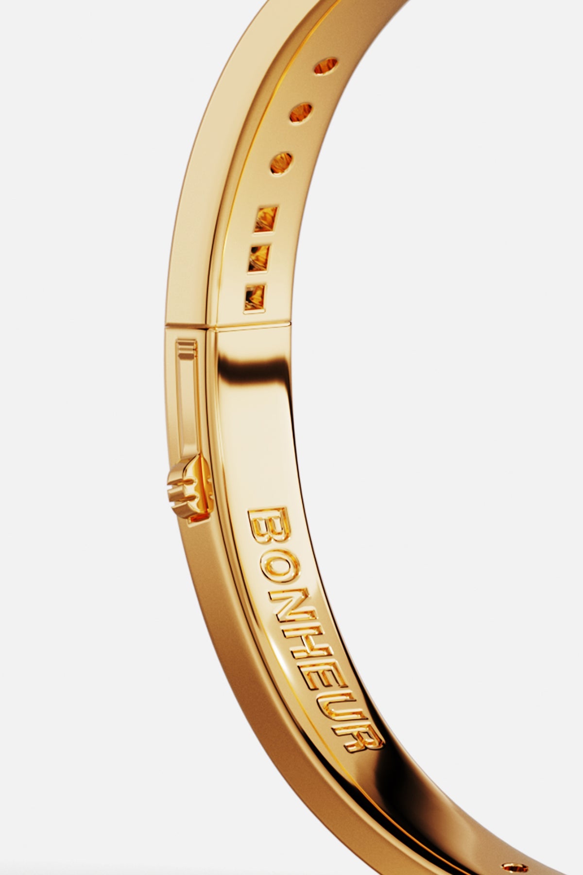 Bracelets APM Monaco: yellow gold bangle with Bonheur engraved on the inside.