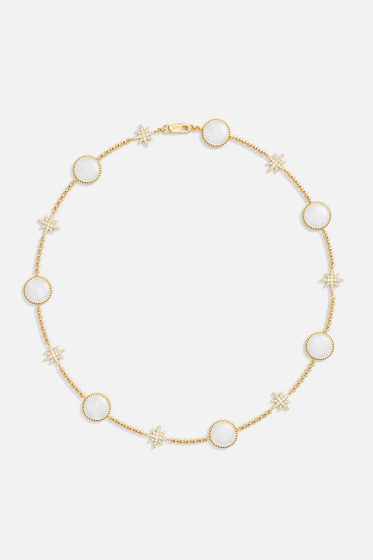 Necklaces APM Monaco: choker with tiny light-yellow beads and round white nacre stones, accented by small white nacre-star shapes.