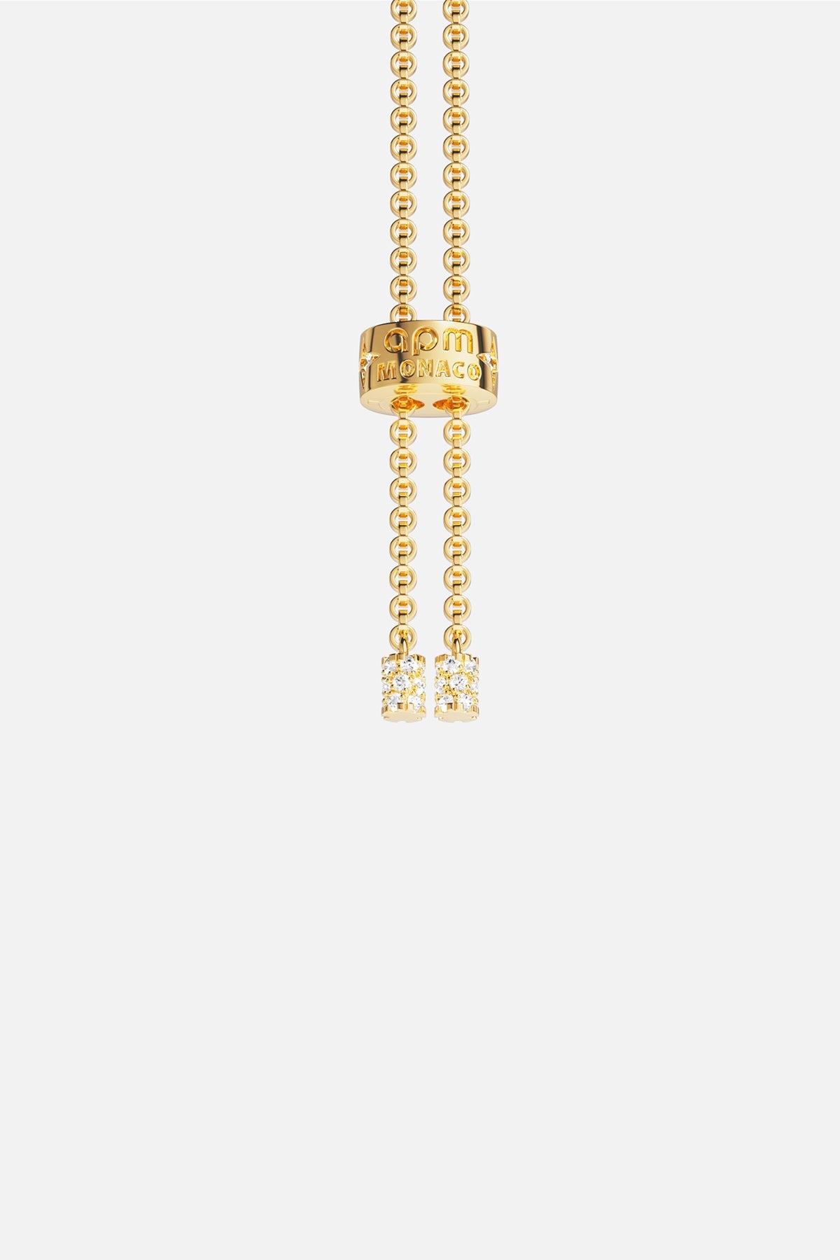 APM MONACO yellow gold adjustable necklace with white stones on a white background